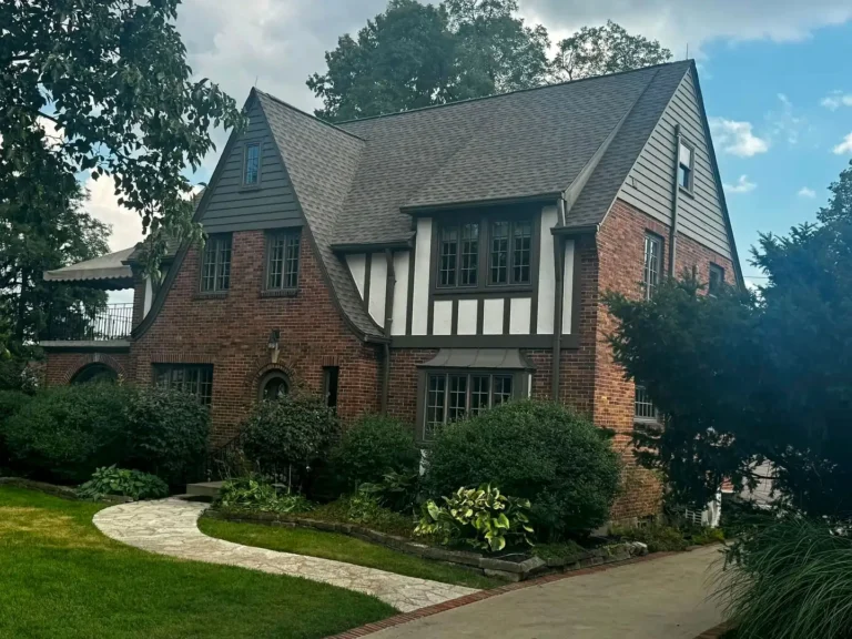 Tudor-style brick home in Oakwood, Ohio with a new GAF Timberline HDZ roof in Weathered Wood