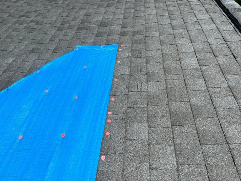 Emergency tarp installed by XPRO ELITE on a damaged roof in Tipp City, Ohio